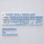 Elegant Yukino Keycaps set for mechanical keyboards, featuring subtle side-engraved legends and vibrant backlighting, ideal for a minimalist design.