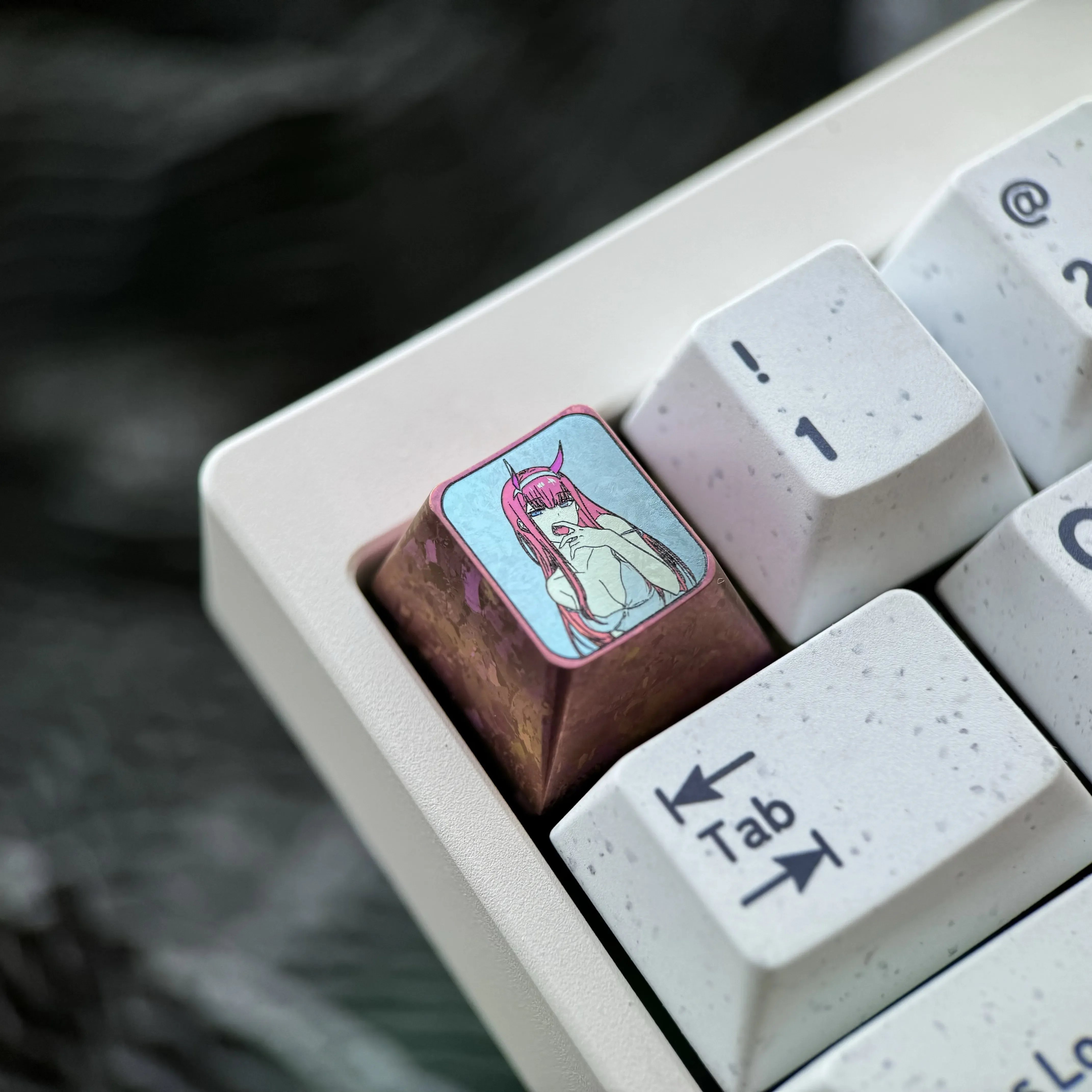 Gallery of the Premium Titanium Zero Two keycap, revealing its iconic anime details and vibrant, durable metal construction for mechanical keyboards.