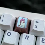 Iconic Zero Two keycap crafted from premium titanium, a vibrant custom anime keycap for enthusiasts of mechanical keyboards.