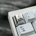 Artisan 2B Titanium Keycap gallery, showcasing precision-engraved Nier Automata 2B character and premium metallic finish from all angles.