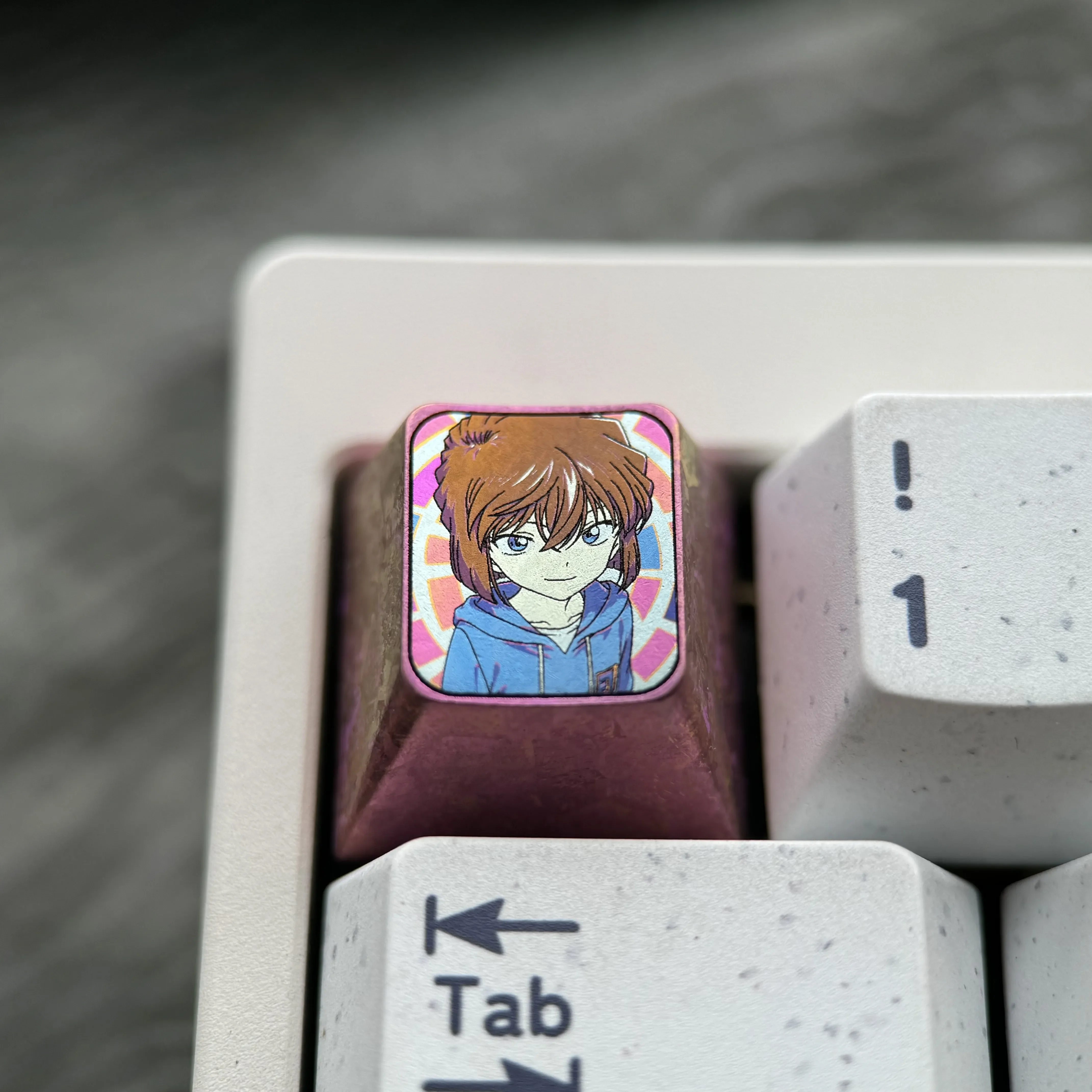 Close-up views of the artistic Ai Haibara Titanium Keycap, revealing the intricate anime design and luxurious metallic texture for mechanical keyboard.