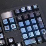 Multiple detailed views of the exclusive Amon Lord of Mysteries keycap set, highlighting its intricate dark fantasy and steampunk design.