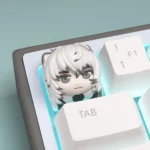 Charming handcrafted Arknights SilverAsh chibi keycap from multiple angles, revealing its vibrant sculpted details and playful aesthetic.