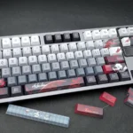 Close-up of premium Arlecchino The Knave keycap set, featuring subtle side-engraved legends and a mysterious dark aesthetic. Double-shot quality.