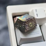 Multiple views of the artisan titanium astronaut keycap, showcasing its intricate hand-carved details and unparalleled keyboard artistry.