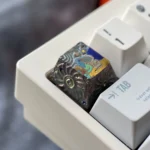 Captivating gallery of the hand-carved titanium astronaut keycap, showcasing its intricate cosmic artistry. Multiple views reveal the unparalleled.