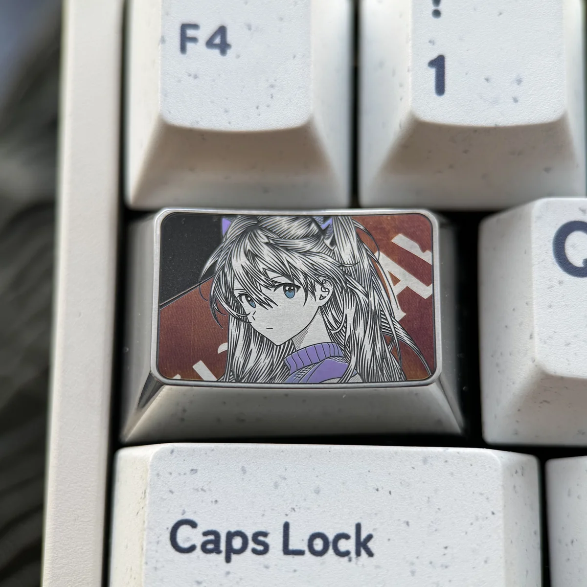 Iconic Asuka Keycap, precision engraved with bold anime art. Features metallic luster and intricate details. This premium Asuka keycap shines art design.