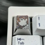 Premium precision-carved Asuka keycap showcasing intricate anime character design and polished metallic finish, an iconic fandom tribute..