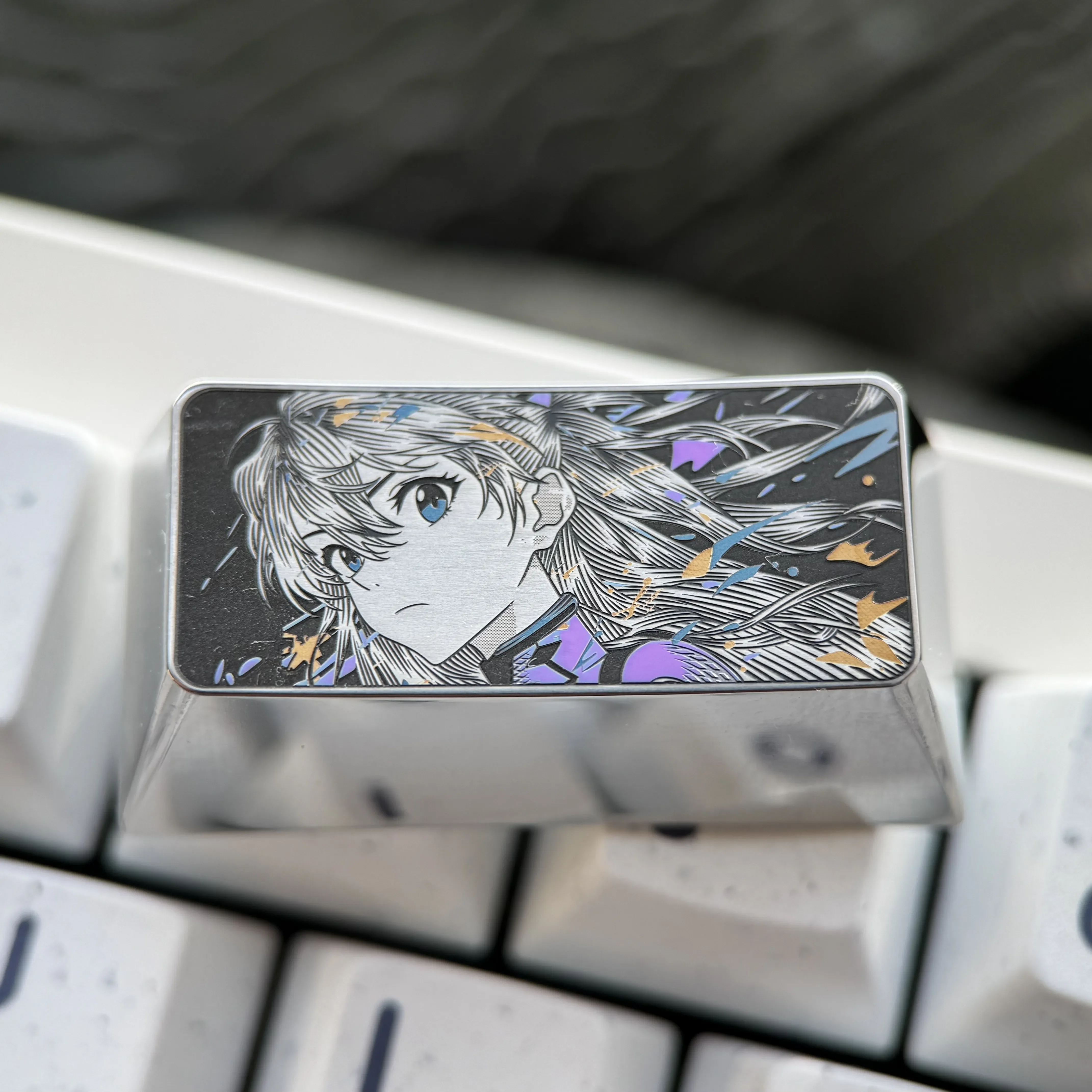 Premium alloy Asuka keycap, showcasing iconic Evangelion art with precision engraving. A high-quality 2U backspace keyboard art piece.