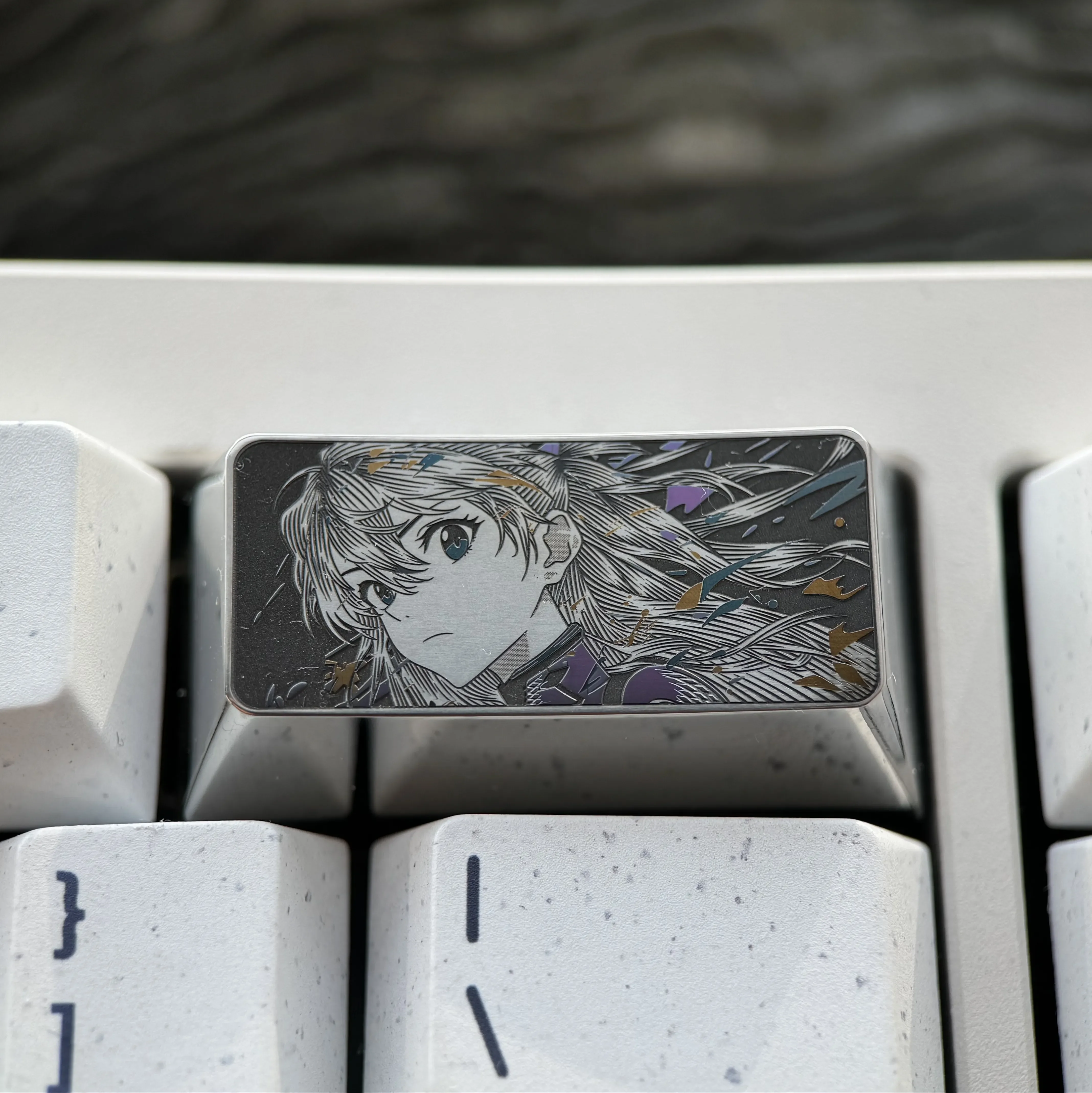 This product gallery image captures the premium alloy Asuka keycap, emphasizing its iconic Evangelion design and the meticulous precision-engraved design.