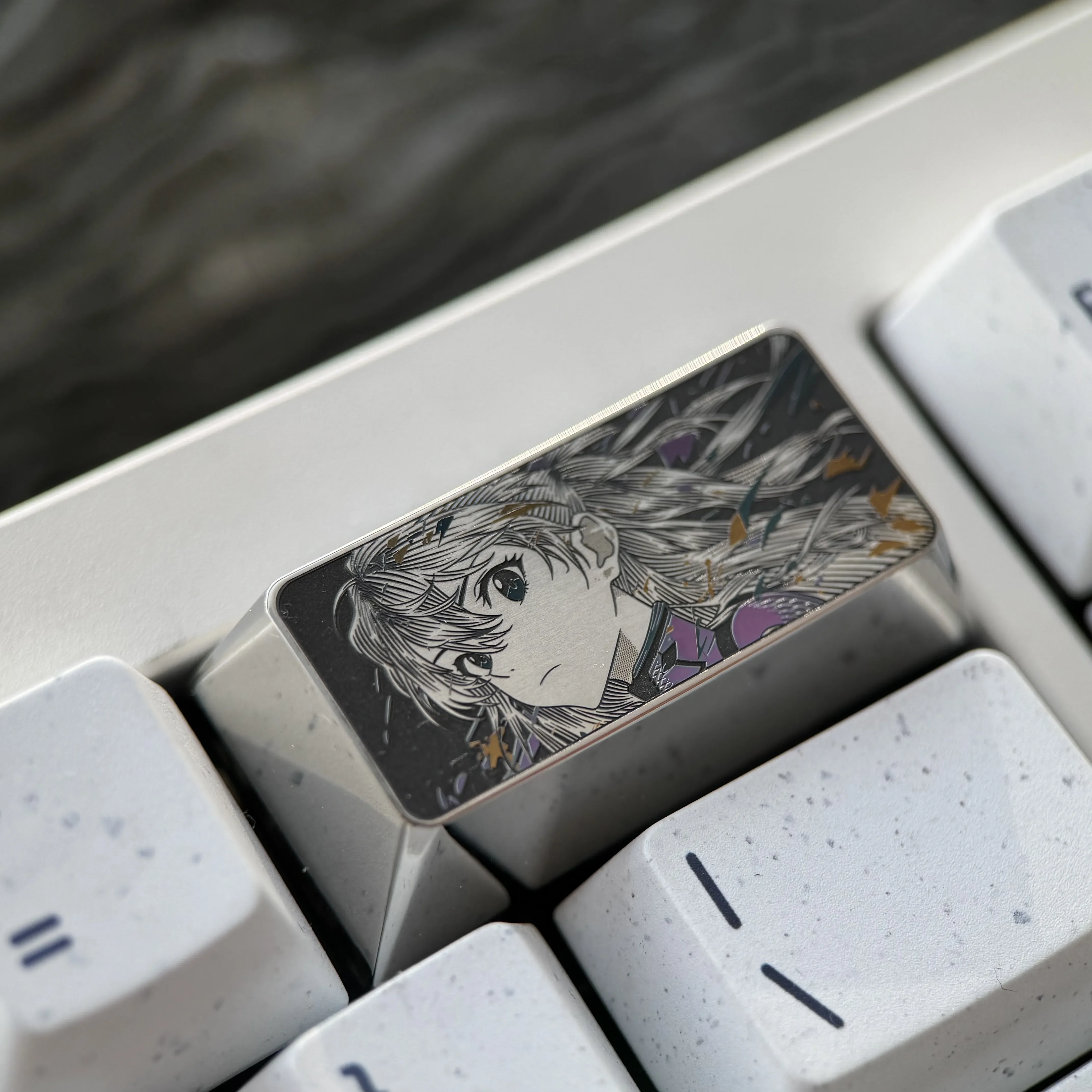 Premium alloy Asuka keycap gallery. Showcasing the iconic Evangelion 2U Backspace keyboard art from various angles, with precision-engraved Asuka character design.