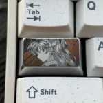 Asuka Keycap featuring precision-engraved Evangelion anime art, showcasing intricate metallic detail and a futuristic mech design.