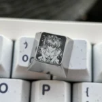 Precision-engraved Asuka titanium alloy keycaps, displaying vibrant sci-fi anime artistry and a premium metallic sheen for enthusiasts.