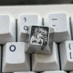 Close-up of the premium Asuka titanium alloy keycaps, showcasing its vibrant sci-fi anime art and precision engraving for Evangelion fans.