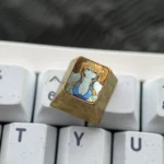Gallery of the premium Asuka Evangelion Titanium Keycap, revealing its vibrant anime design and precision alloy craftsmanship.
