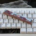 Premium handcrafted Asuka Titanium Keycap artisan space key, showcasing its striking deep red Evangelion mecha artistry.