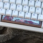 Handcrafted Asuka Titanium Keycap artisan space key prominently displayed, featuring intricate deep red mecha artistry inspired by Evangelion.
