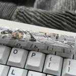 Asuka Titanium Keycap gallery featuring the precision-engraved spacebar with vibrant anime mecha details and durable titanium finish, shown from multiple angles.
