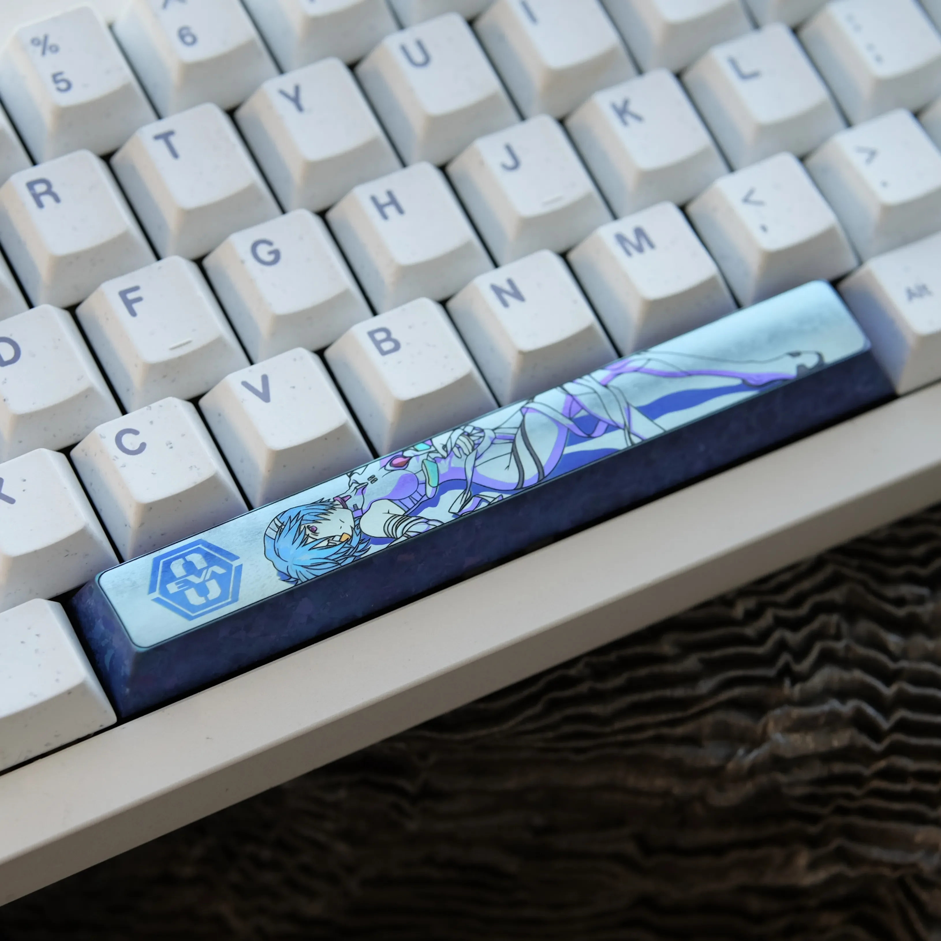 Iconic Ayanami Rei titanium space key keycap, featuring vibrant anime art and a polished, durable sci-fi aesthetic.