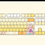Official BanG Dream Tsurumaki Kokoro PBT keycaps set in a vibrant gallery view, showcasing cheerful anime art, high-contrast legends, and durable finish setup.