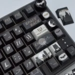 Exclusive DC Batfamily Batman keycaps set, premium quality, showcasing intricate dark iconography and vibrant character details from multiple angles.