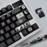 Close-up of exclusive DC Batfamily Batman keycaps from different perspectives, revealing dark, iconic designs and vibrant hero accents.
