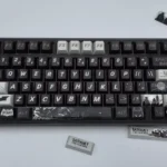 Exclusive DC Batfamily Batman keycaps set featuring iconic dark iconography with vibrant accents, showcasing this premium themed collection.