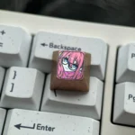 Vibrant premium titanium Bocchi Keycaps set showcasing Hitori Gotohs iconic glasses and anime directional keys with artistic craftsmanship.