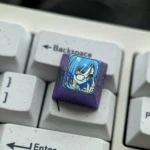 Artistic Premium Titanium Bocchi Keycaps display, showcasing vibrant anime characters, iconic directional keys, and character glasses.