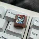 Vibrant premium titanium Bocchi the Rock keycaps display, showcasing anime directional keys and the iconic character glasses keycap.