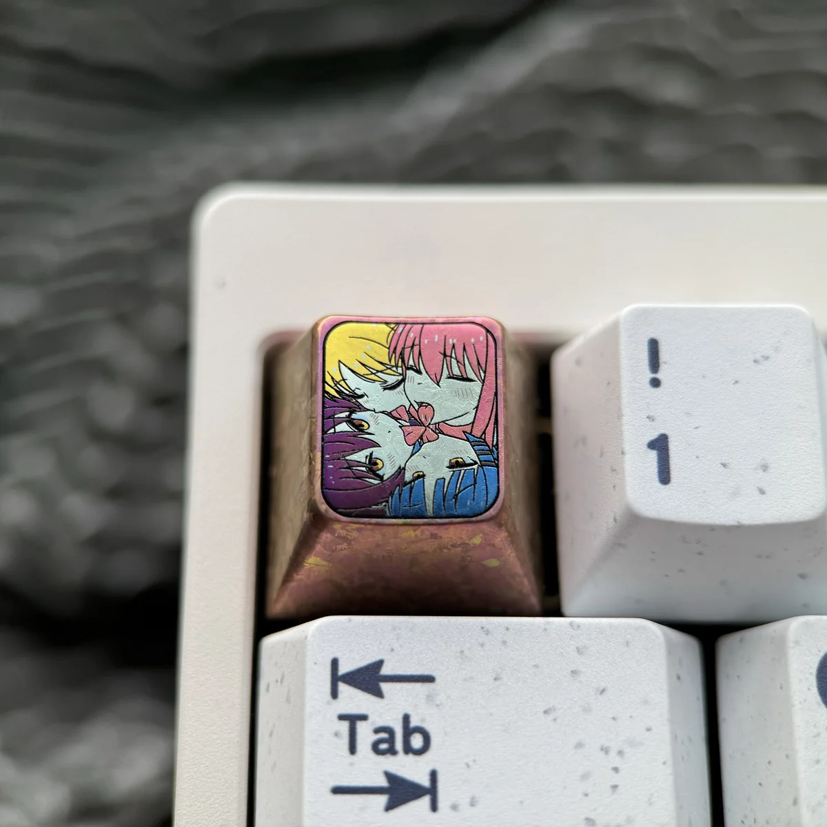 Bocchi the Rock! premium titanium artisan keycap featuring vibrant anime characters. Exquisitely anodized on durable titanium, shown from various angles.