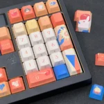 Multiple perspectives of the exclusive Caleb Keycap Set, emphasizing the elegant side-printed legends and premium, character design.