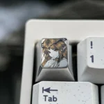 Cartethyia precision-engraved titanium anime ESC keycap displayed, revealing intricate pointillism detail and artistic polished metal finish.