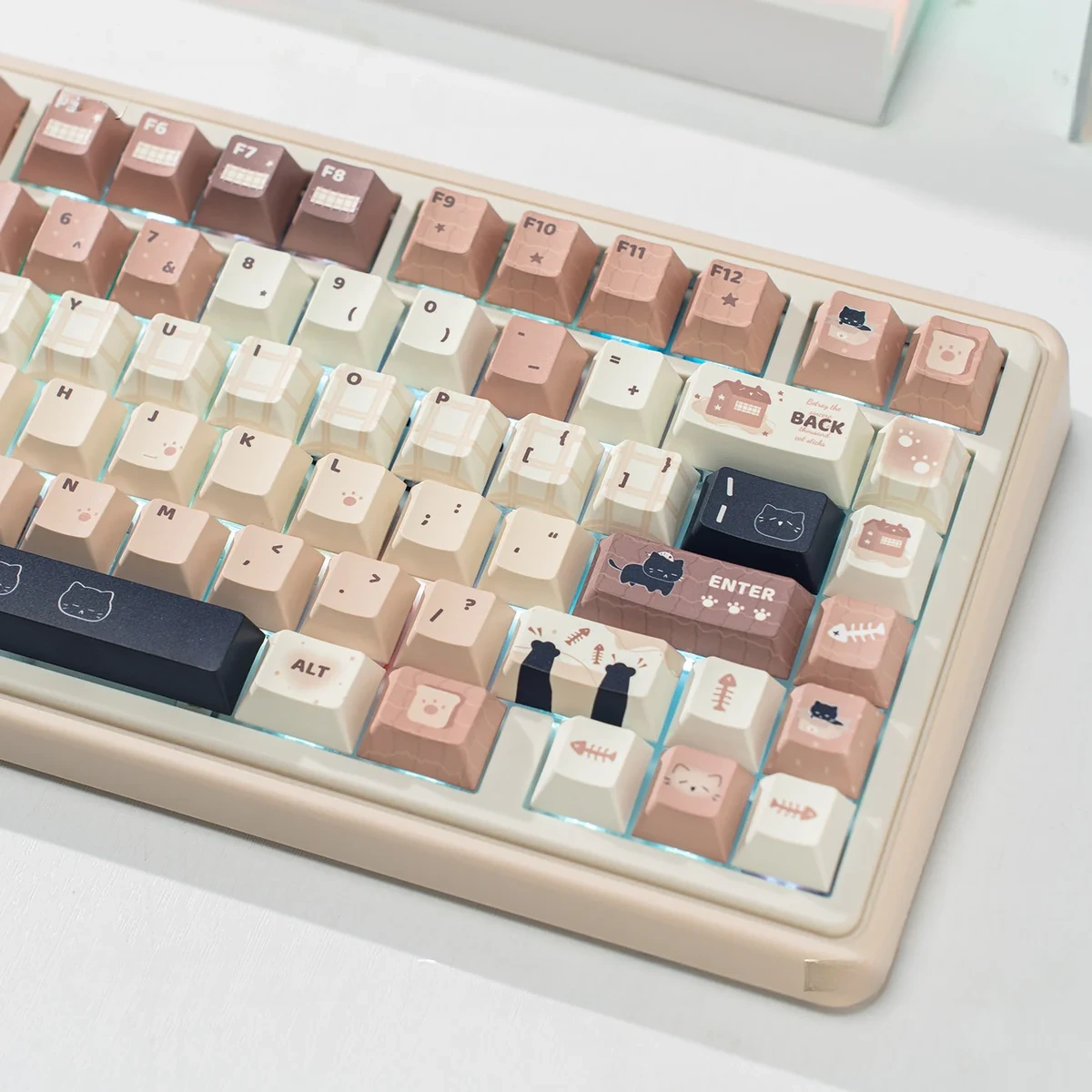 Collection of whimsical cat keycaps set, showcasing durable PBT dye-sub designs and charming feline art in a cozy coffee & cream theme.