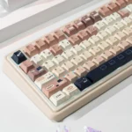 Whimsical Cat Keycap Set featuring durable PBT dye-sublimated keycaps with charming cat illustrations in a cozy coffee and cream palette.