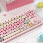 Showcase of kawaii cat keycaps with pastel dye-sub artwork, featuring mint, pink, and candy-sweet elements arranged in a clean gallery layout.