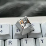 Chainsaw Man Denji titanium keycap gallery showcasing precision-engraved anime art and premium metallic craftsmanship from multiple angles.
