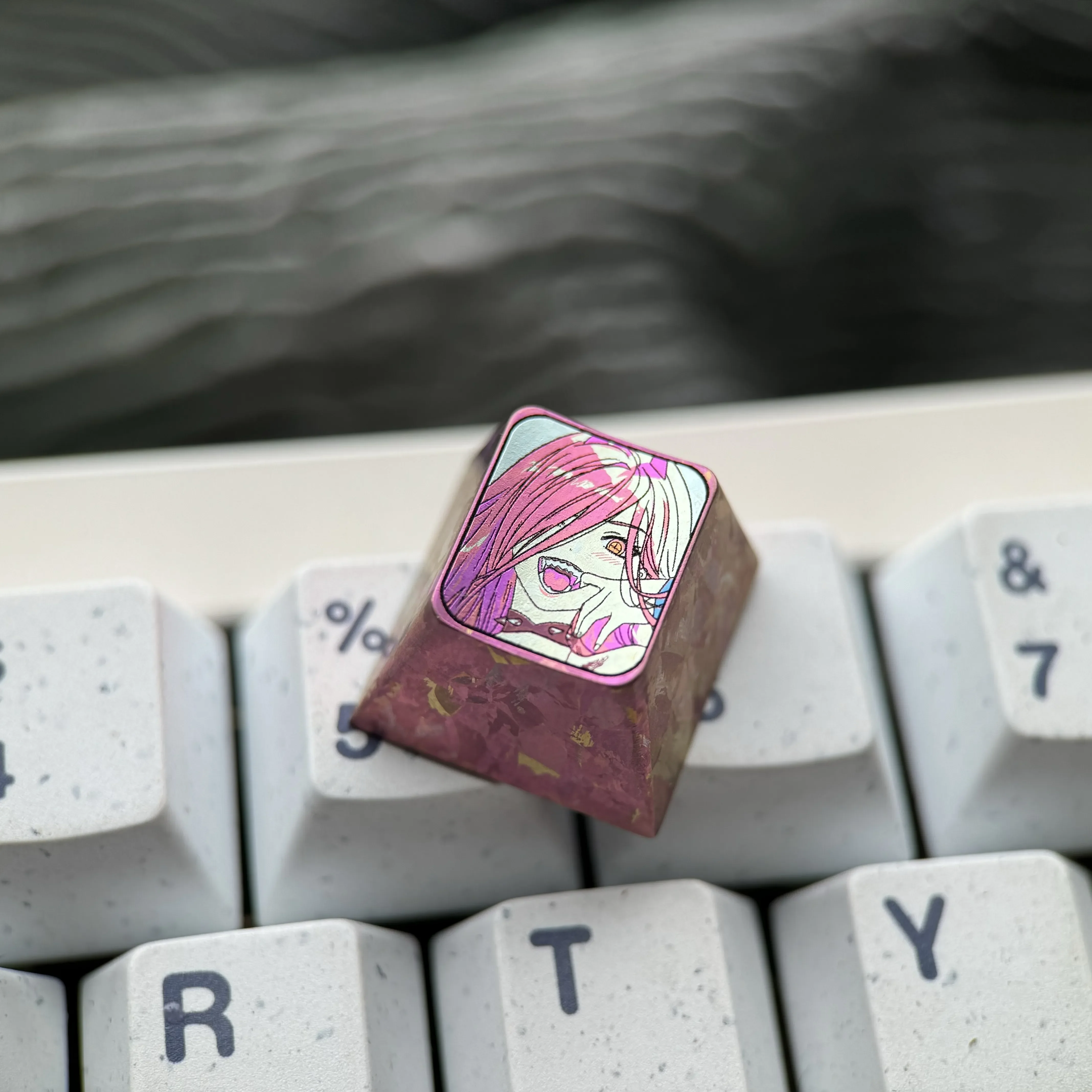 Premium Chainsaw Man Power titanium keycap gallery. Vibrant anime design, meticulously crafted from colored titanium, shown in various artistic angles.