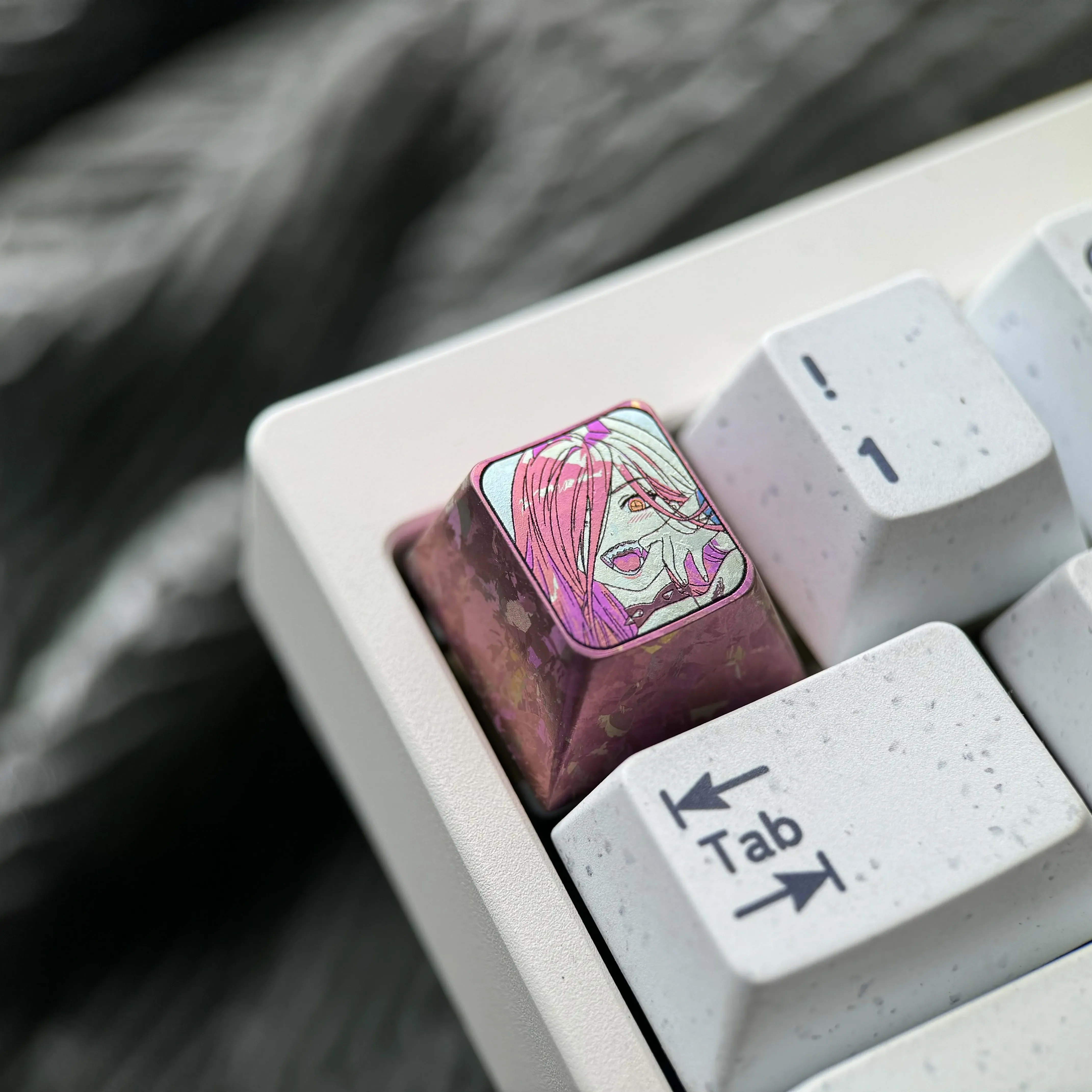 Multiple views of the vibrant Chainsaw Man Power titanium keycap, highlighting its premium anime design and meticulous craftsmanship for keyboard.
