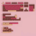 Decadent PBT dye-sublimated liquor chocolate keycaps set, elegantly displayed, featuring rich gourmet browns and creamy accents for mechanical keyboards.