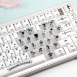 Multiple views of the Mint Crystal Jelly Chrome Hearts Keycap Set, showcasing its side-engraved gothic details and translucent PC+ABS crystal jelly design.