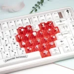 Artistic gallery views of the Mint Crystal Jelly Chrome Hearts Keycap Set, revealing its side-engraved gothic detail and translucent glow.