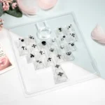 Close-up of a Mint Crystal Jelly Chrome Hearts Keycap Set, showcasing its side-engraved gothic heart and cross, with translucent PC+ABS elegance.