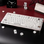 Artistic Mint Crystal Jelly Chrome Hearts Keycap Set, side-engraved with gothic heart and cross designs, showcasing its translucent elegance.