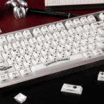 Mint Crystal Jelly Chrome Hearts Keycap Set gallery, showcasing its translucent PC+ABS, side-engraved gothic heart and cross details from various angles.