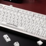 Artistic gallery views of the Mint Crystal Jelly Chrome Hearts Keycap Set, showcasing its translucent mint glow and exquisite side-engraved gothic cross.