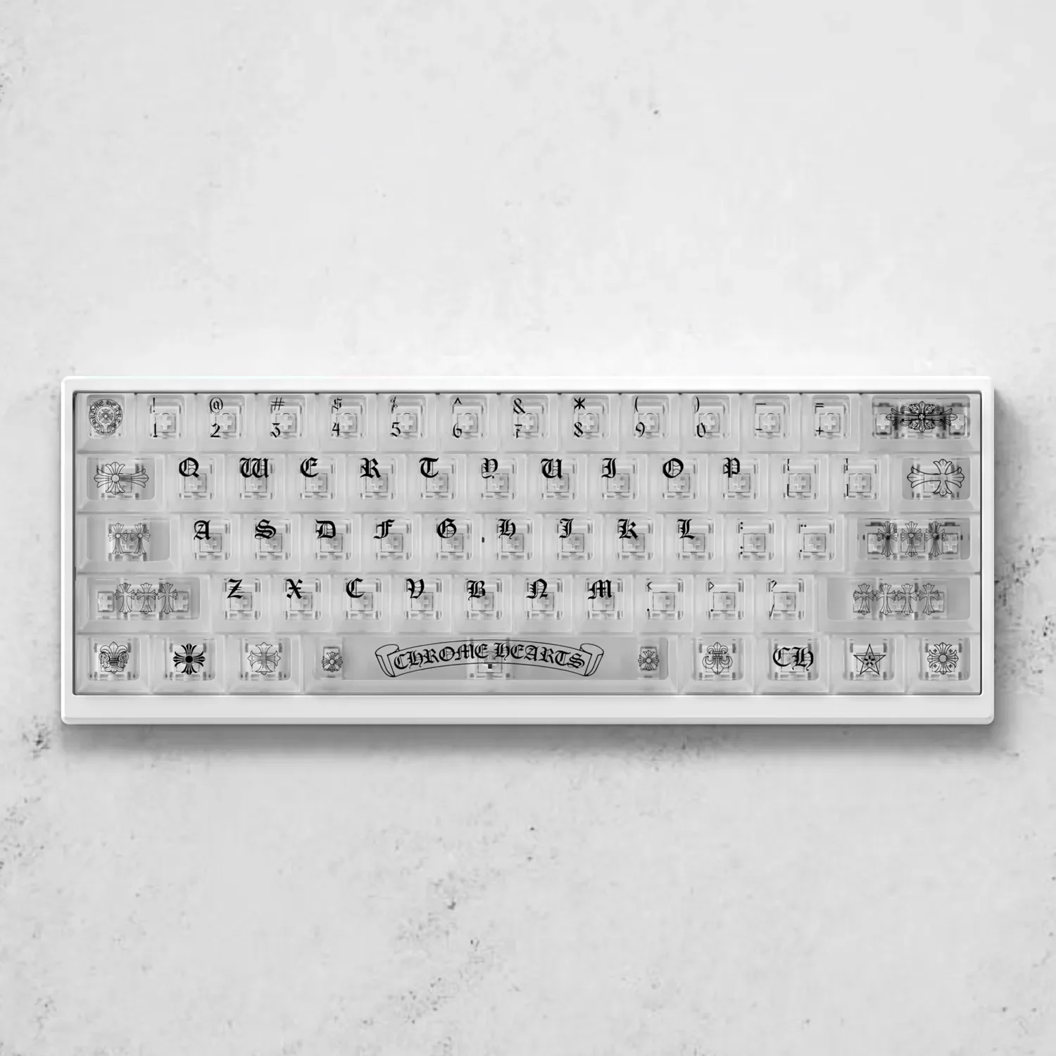 Gothic luxury Chrome Hearts keycaps set, crafted from frosted translucent PC, showcased from multiple angles highlighting its iconic edgy design.
