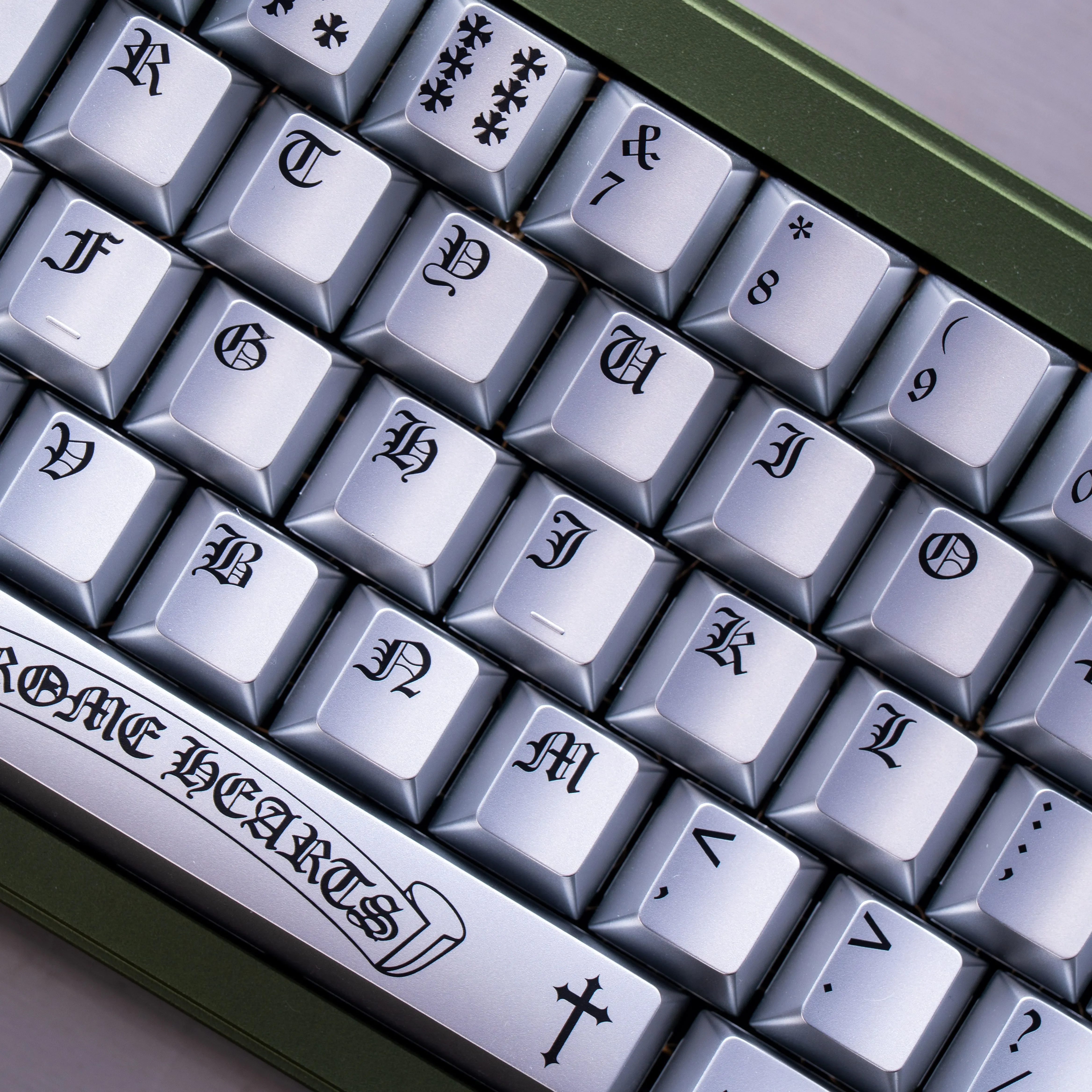 Showcase of Chrome Hearts Keycap Set with distressed finish and Chrome Hearts style motifs. This PBT accent keycap is magnetic