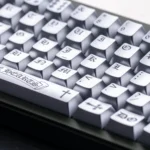 Multiple views of the Chrome Hearts Keycap Set, Chrome Hearts style. Highlights its dark, distressed finish and magnetic switch.