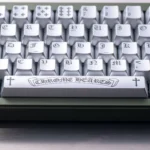 Multiple angles of the Chrome Hearts Keycap Set, showcasing its distressed chrome finish, iconic rebel style, and magnetic switch.